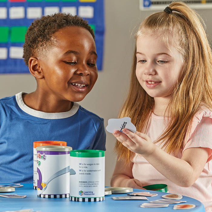 Two Kids in Classroom Learning with Alphabet Soup Game
