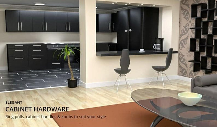 Modern kitchen and dining area with sleek black cabinets, a breakfast bar, potted plant, glass coffee table, and elegant solid brass cabinet pull hardware by Prima Decorative Hardware. Text overlay highlights the cabinet hardware.