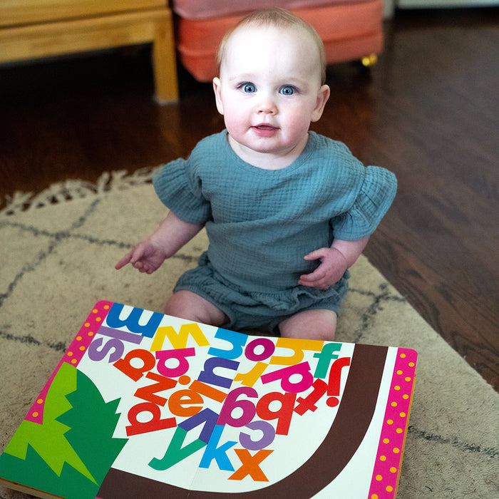 Toddler with Chicka Chicka Boom book