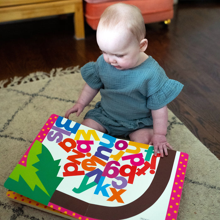 Toddler with Chicka Chicka Boom book