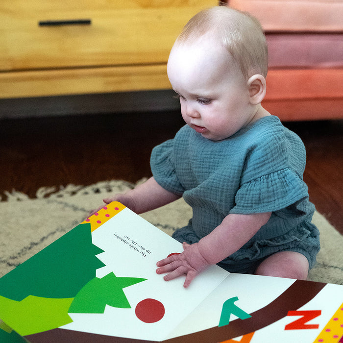 Toddler with Chicka Chicka Boom book