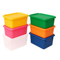 Set of colorful storage boxes stacked on a white background