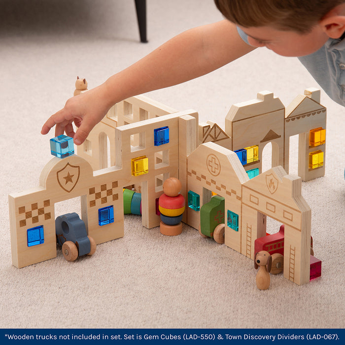 Kid Playing with Color & Light Town Builder Set Inside