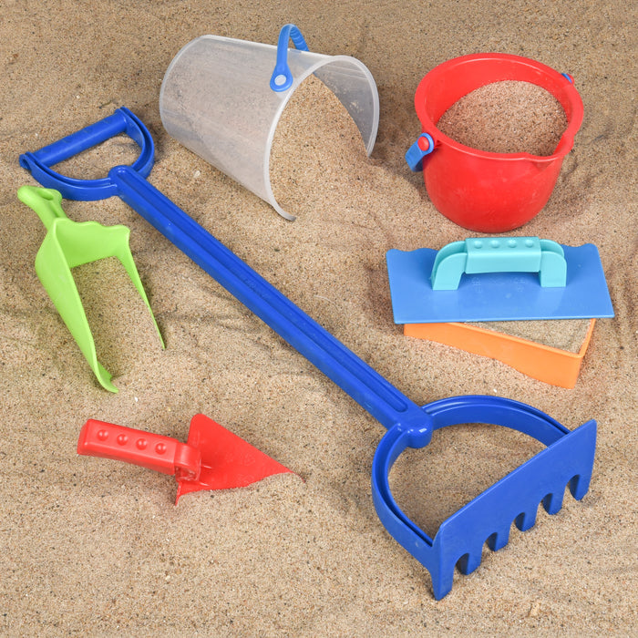 Set of colorful sand toys including a blue spade, red bucket, and various shovels on sand.