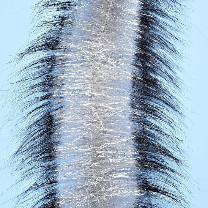 Silver metallic fiber EP Invader brush flanked by long black hair fibers