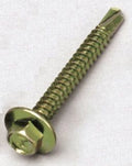 Metal screw with a green tint on a white background