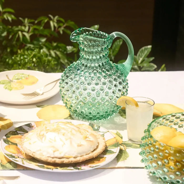 Hobnail Glass Pitcher in Capri Sea on a table at Addison West