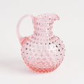 Hobnail Glass Pitcher in Petal Pink on a white background at Addison West