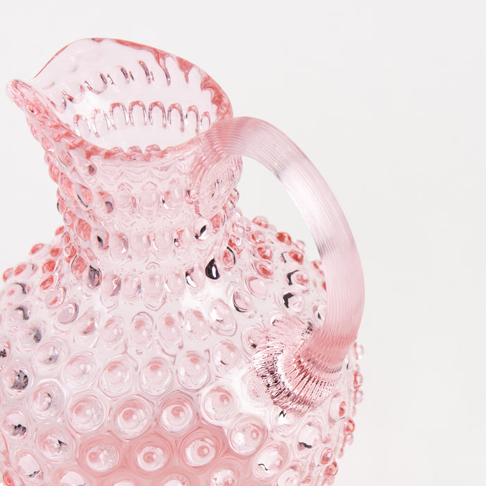 Hobnail Glass Pitcher in Petal Pink on a white background at Addison West