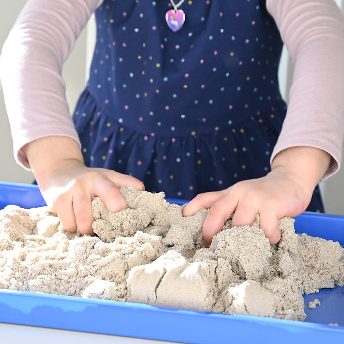 Kid Squishing Tactile Kinetic Sand