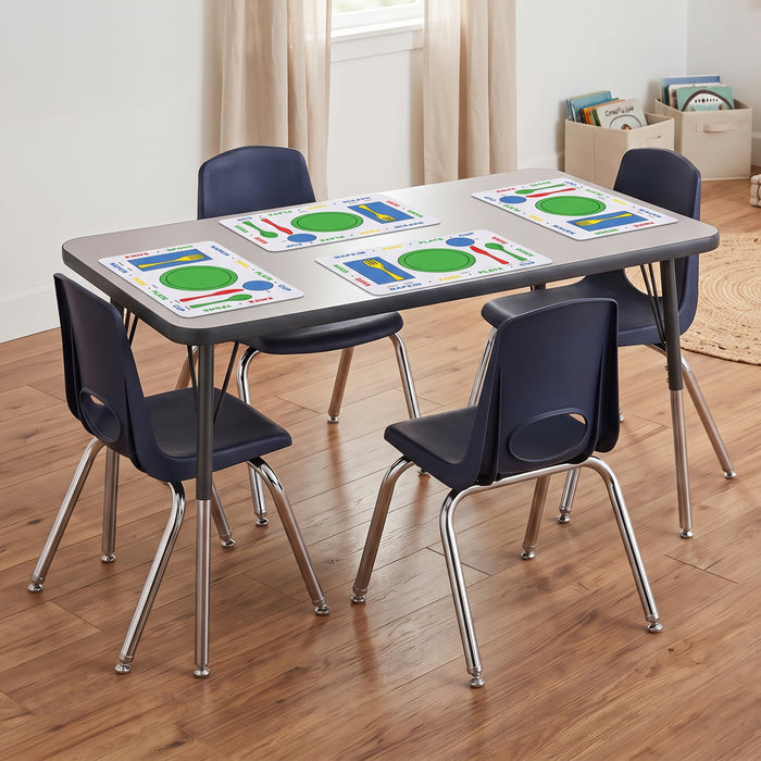 A children's dining set with a gray rectangular table and four dark blue chairs with chrome legs, arranged on a wood floor in a room with curtains and storage bins.
