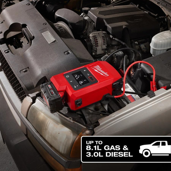 Red Milwaukee battery pack on a car engine with text indicating capacity. | Auto Obsessed