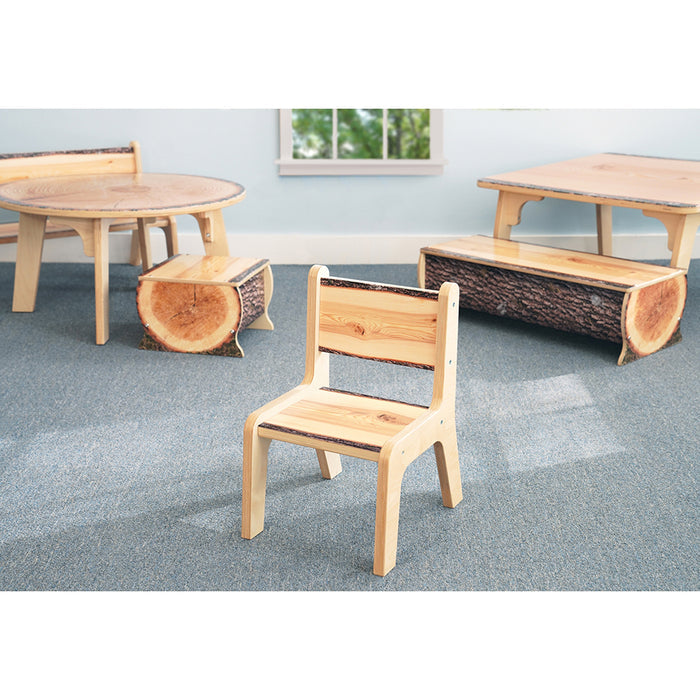 Wooden children's furniture set including a chair, table, and benches on a gray floor.