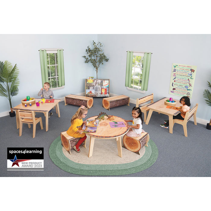 Children playing in a classroom with wooden tables and chairs, featuring the Spaces Learning logo.