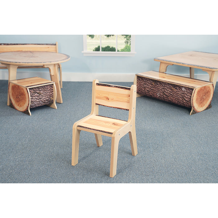 Wooden chair and tables in a classroom setting with a window in the background.