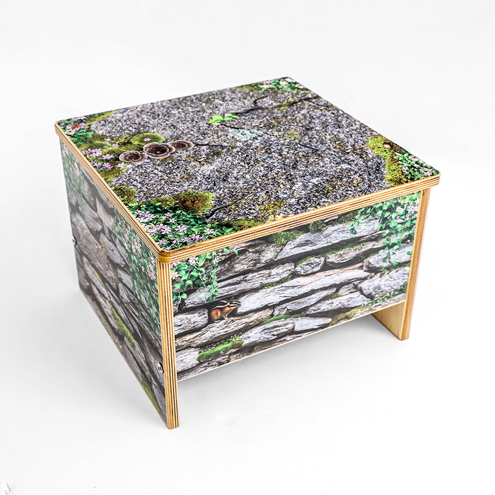 Wooden stool with nature-themed design on a white background