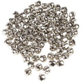 Pile of nickel plated jingle bells on white background