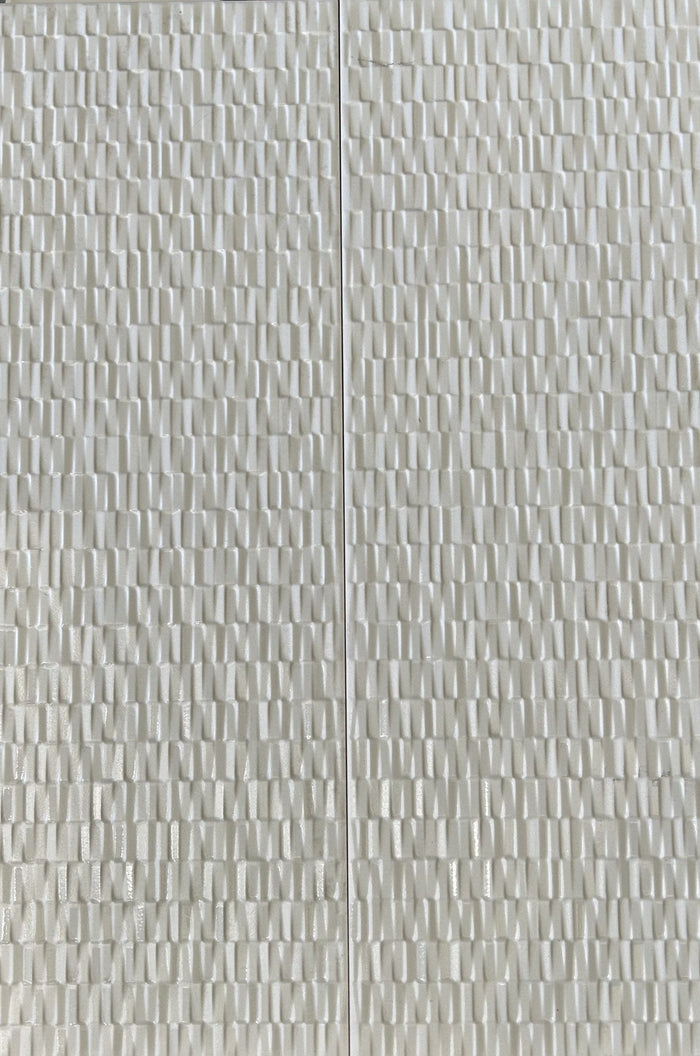 Large rectangular white tiles with a feature design