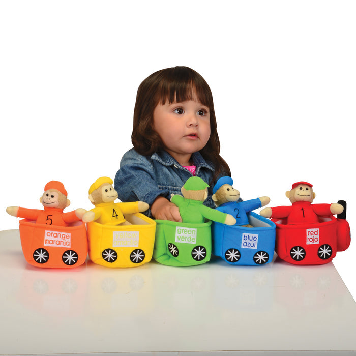 Child with colorful toy cars and figures on a white background