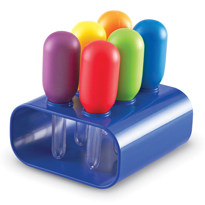 Colorful plastic items in a blue holder on a white background