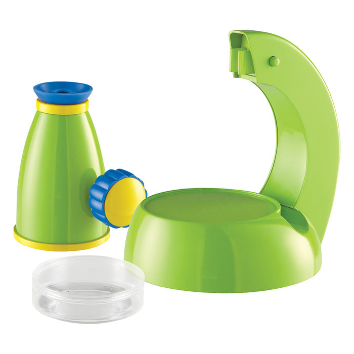 Green plastic toy with blue and yellow accents on a white background