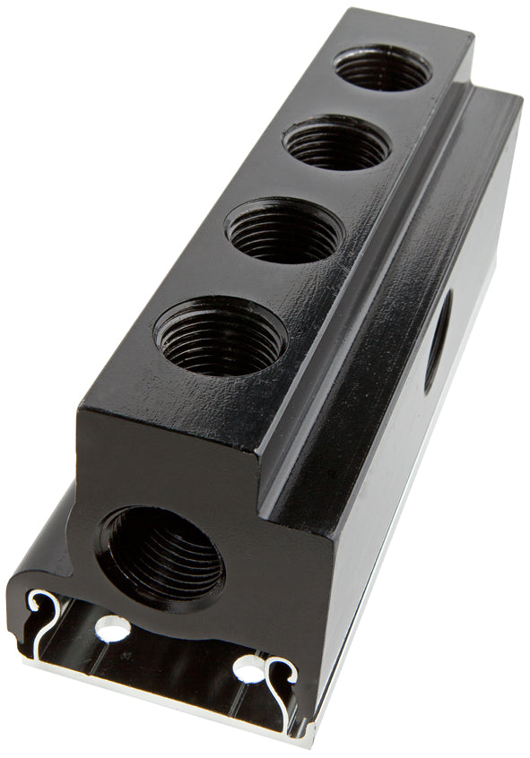 Black metal block with multiple threaded holes on a white background