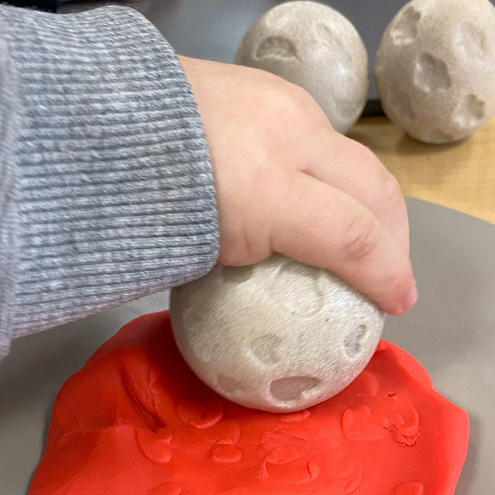 Kid Using Sensory Roller with Modeling Dough