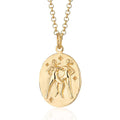 Scream Pretty brand gold Gemini zodiac star sign necklace on a white background