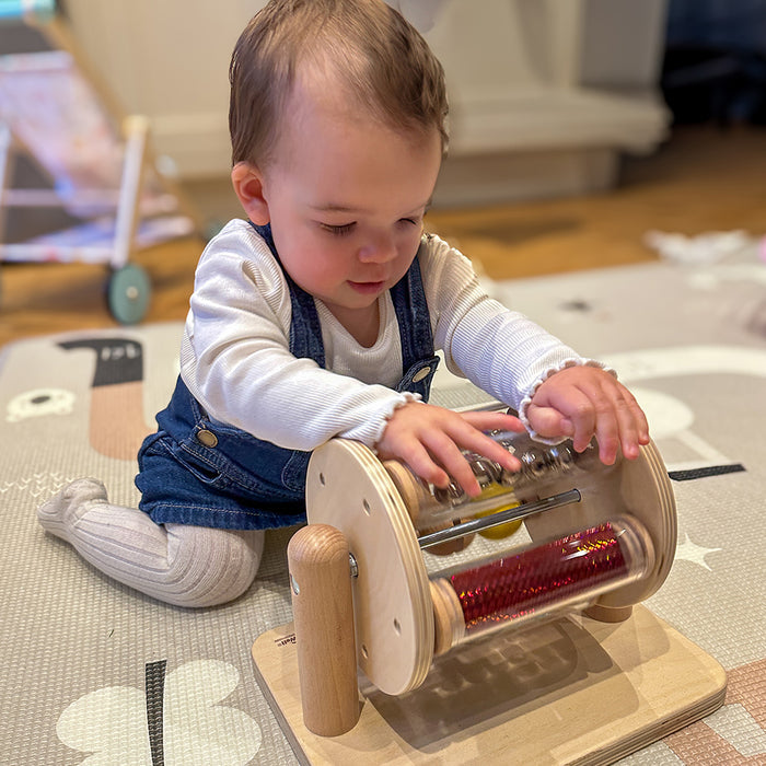 Infant Using Sight & Sound Sensory Drum