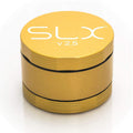 Gold-colored SLX Ceramic Coat Grinder with FDA-approved ceramic coating engraved top