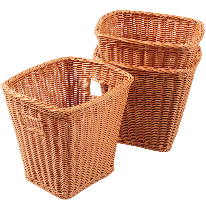 Tall wicker baskets on white background