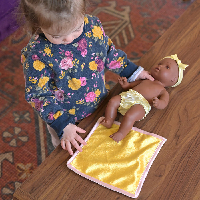 Toddler Playing with Ultra-Soft & Realistic Tender Touch African American Baby Doll & Blanket