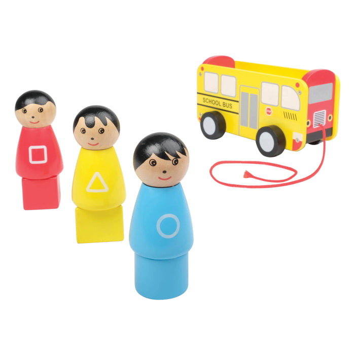 Colorful wooden figures of children and a school bus on a white background
