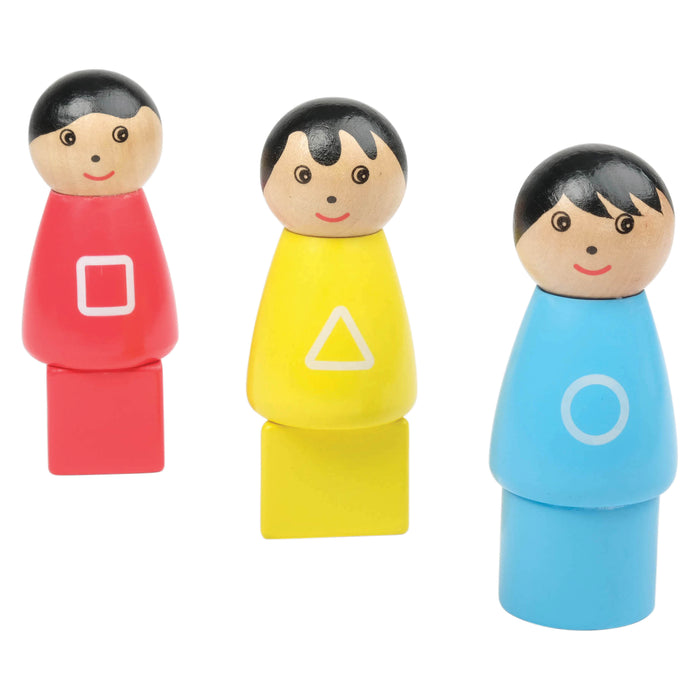 Three wooden figurines with colorful bodies and geometric symbols on a white background