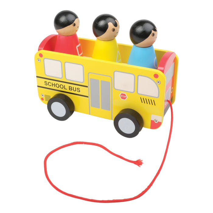 Toy school bus with pull string and three figurines on a white background